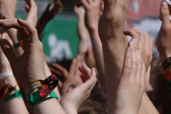 Wristbands on Hands at an Event