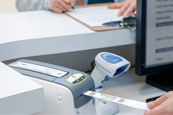 Bar Code Data Wristband coming out of printer